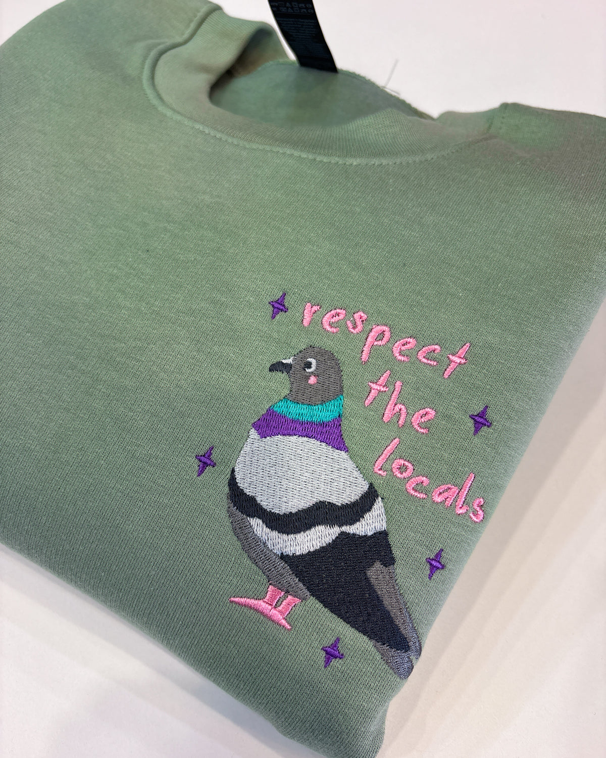 Pigeon 'Respect The Locals' Embroidered Unisex Sweatshirt